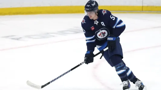 Winnipeg Jets' Mark Scheifele skates with the puck