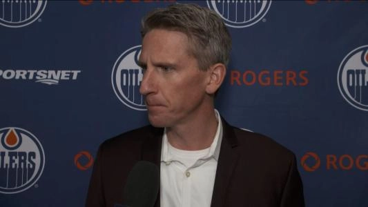 Edmonton Oilers head coach Kris Knoblauch listening to a question