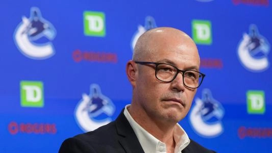 Vancouver Canucks GM Patrik Allvin with a serious facial expression