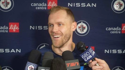 Carolina Hurricanes' Nikolaj Ehlers speaks to Winnipeg reporters