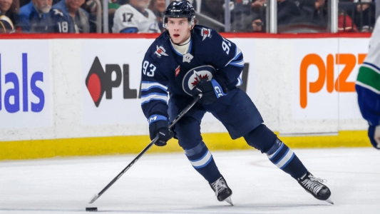 Winnipeg Jets' Brad Lambert skates with the puck during a game