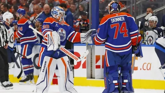 Edmonton Oilers goalies swap the net after a pull