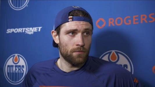 Edmonton Oilers' Leon Draisaitl looks at a reporter during an interview