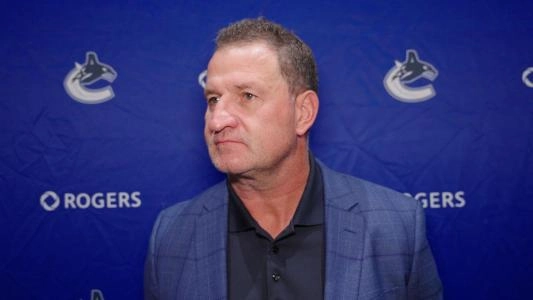 Vancouver Canucks head coach Adam Foote speaks to reporters