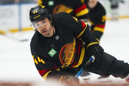 Nov 20, 2025; Vancouver, British Columbia, CAN; Vancouver Canucks forward Kiefer Sherwood (44) shoots during warm up prior to a game against the Dallas Stars at Rogers Arena