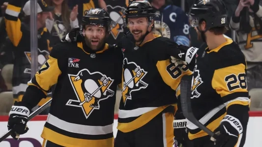 Pittsburgh Penguins' Erik Karlsson celebrates a goal with his teammates