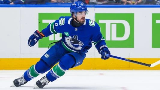 Vancouver Canucks forward Conor Garland playing in a home game in the NHL.