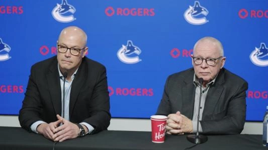 Vancouver Canucks GM Patrik Allvin (left) and President Jim Rutherford (right)
