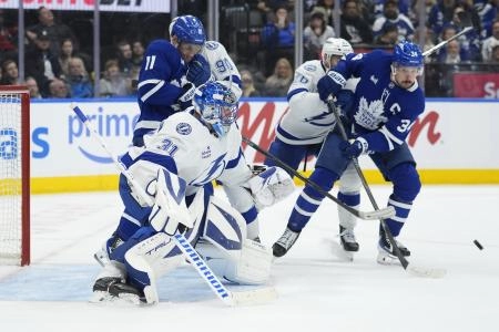 Dec 8, 2025; Toronto, Ontario, CAN; Toronto Maple Leafs forward Auston Matthews (34) tries to deflect a shot at Tampa Bay Lightning goaltender Jonas Johansson (31) during the third period at Scotiabank Arena