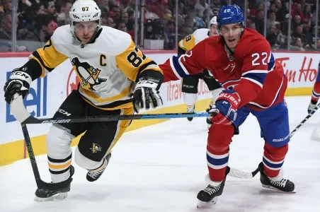 Penguins captain Sidney Crosby in a puck battle with a Canadiens forward