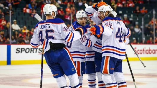 Edmonton Oilers' Riley Stillman celebrates a goal with his teammates