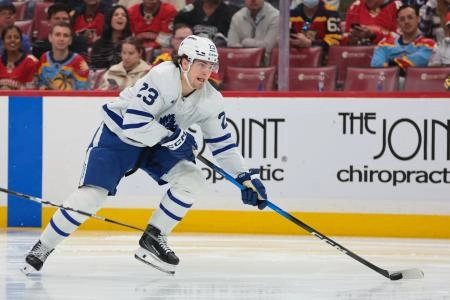 Dec 2, 2025; Sunrise, Florida, USA; Toronto Maple Leafs left wing Matthew Knies (23) moves the puck against the Florida Panthers during the second period at Amerant Bank Arena.