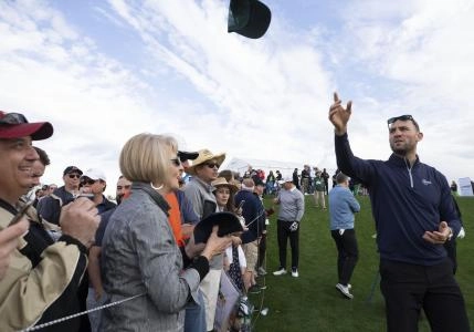 Former Coyote Paul Bissonnette tosses hats to fans on the 10th tee box during the Waste Management Phoenix Open Annexus Pro-Am at TPC Scottsdale Stadium Course. Bissonnette was Doan's caddie. Annexus Pro Am