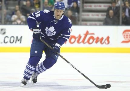 Mar 20, 2012; Toronto, ON, Canada; Toronto Maple Leafs left wing Jay Rosehill (38) carries the puck against the New York Islanders at the Air Canada Centre. The Islanders beat the Maple Leafs 5-2.