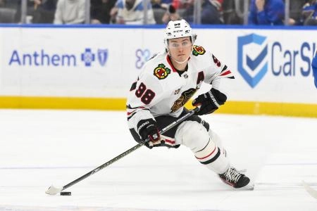 Dec 12, 2025; St. Louis, Missouri, USA; Chicago Blackhawks center Connor Bedard (98) controls the puck against the St. Louis Blues during the third period at Enterprise Center.