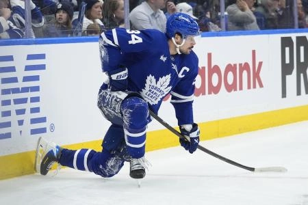 Dec 11, 2025; Toronto, Ontario, CAN; Toronto Maple Leafs forward Auston Matthews (34) takes a knee after colliding with the boards against the San Jose Sharks during the third period at Scotiabank Arena.