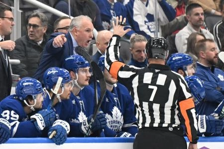 Dec 6, 2025; Toronto, Ontario, CAN; Toronto Maple Leafs head coach Craig Berube gestures as he speaks to referee Garrett Rank (7) in the first period at Scotiabank Arena.