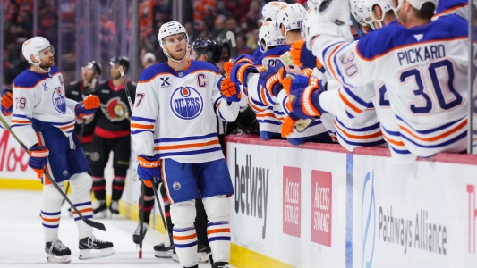 Edmonton Oilers' Connor McDavid celebrates a goal with his teammates on the bench