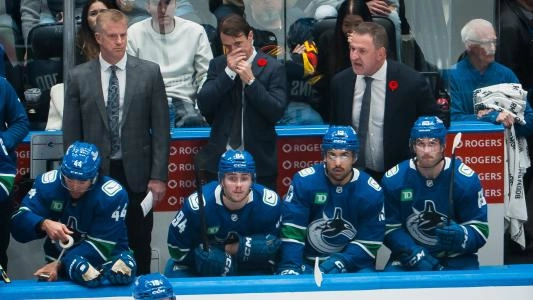 Vancouver Canucks' Arshdeep Bains sits on his team's bench