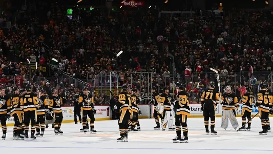 Pittsburgh Penguins players salute the crowd