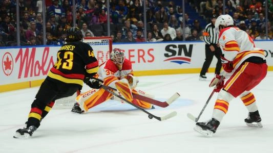 Vancouver Canucks' Quinn Hughes plays vs. the Calgary Flames