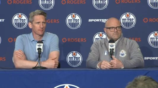 Oiler GM Stan Bowman and coach Kris Knoblauch