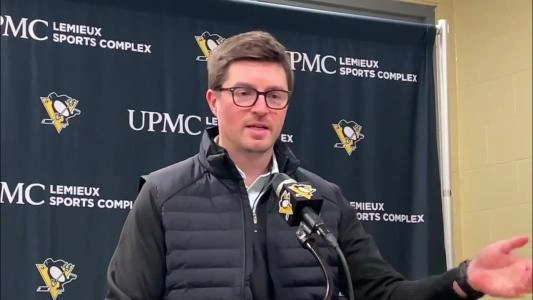 Pittsburgh Penguins GM Kyle Dubas answers a question at a presser