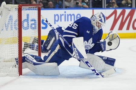 Dec 8, 2025; Toronto, Ontario, CAN; Toronto Maple Leafs goaltender Dennis Hildeby (35) makes a glove save against the Tampa Bay Lightning during the second period at Scotiabank Arena