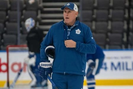 Toronto Maple Leafs head coach Craig Berube skates during a team practice.