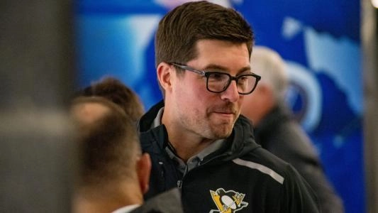 Pittsburgh Penguins GM Kyle Dubas has a smirk on his face