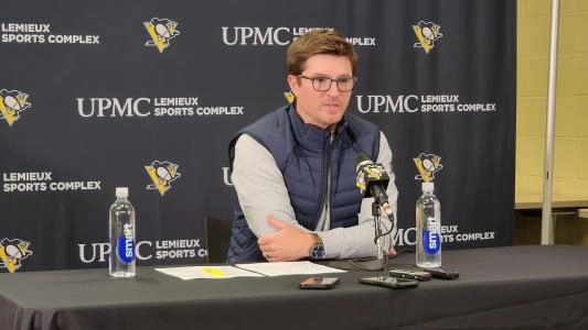 Pittsburgh Penguins GM Kyle Dubas sits at a press conference