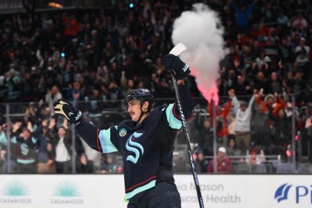 Dec 16, 2025; Seattle, Washington, USA; Seattle Kraken left wing Mason Marchment (27) celebrates a goal scored by right wing Jordan Eberle (7) (not pictured) during the second period against the Colorado Avalanche at Climate Pledge Arena. Mandatory Credit: Steven Bisig-Imagn Images