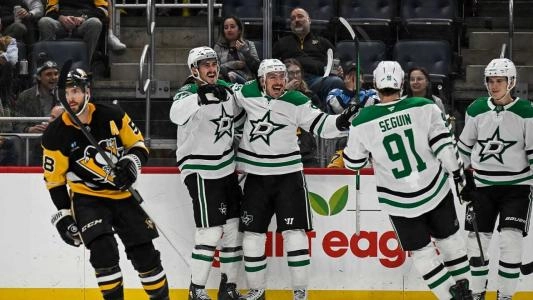 Dallas Stars players celebrate a goal vs. the Penguins