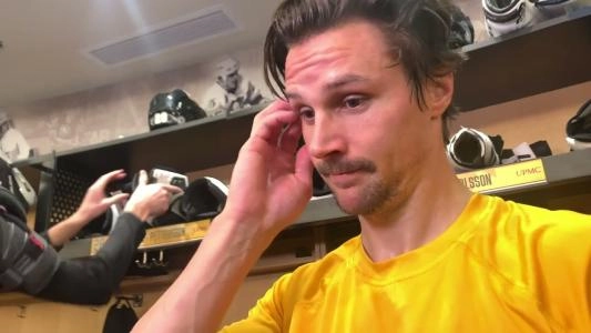Pittsburgh Penguins' Erik Karlsson scratches his head during an interview
