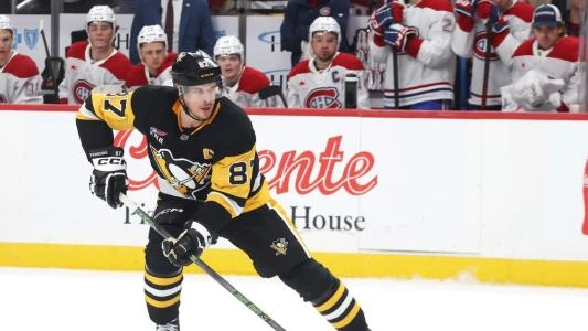 Pittsburgh Penguins' Sidney Crosby skates in front of the Montreal Canadiens bench