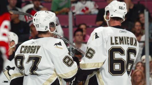 Pittsburgh Penguins' Sidney Crosby (left) and Mario Lemieux (right)