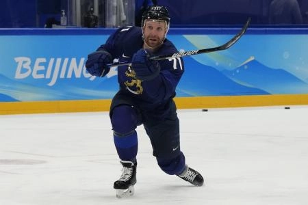 Feb 20, 2022; Beijing, China; Team Finland forward Leo Komarov (71) shoots a puck during warmups prior to the game against Team ROC during the Beijing 2022 Olympic Winter Games at National Indoor Stadium.
