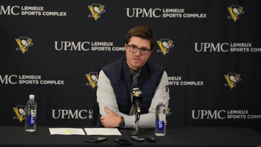 Pittsburgh Penguins GM Kyle Dubas sits at a press conference