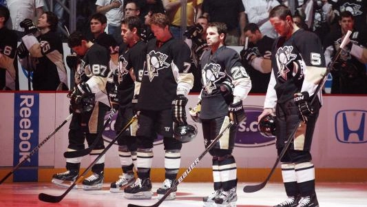 Pittsburgh Penguins players line up for the anthem