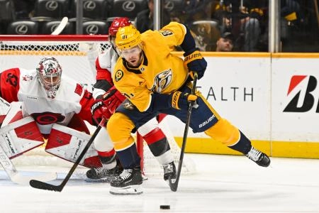 Dec 17, 2025; Nashville, Tennessee, USA; Nashville Predators center Jonathan Marchessault (81) skates behind the net against the Carolina Hurricanes during the first period at Bridgestone Arena.