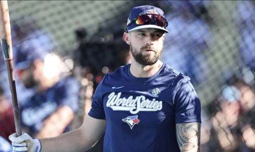 Oct 28, 2025; Los Angeles, California, USA; Toronto Blue Jays right fielder Nathan Lukes (38) warms up before the game against the Los Angeles Dodgers during game four of the 2025 MLB World Series at Dodger Stadium. Mandatory Credit: Kiyoshi Mio-Imagn Images