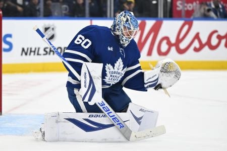 Dec 23, 2025; Toronto, Ontario, CAN; Toronto Maple Leafs goalie Joseph Woll (60) makes a glove save against the Pittsburgh Penguins in the second period at Scotiabank Arena.
