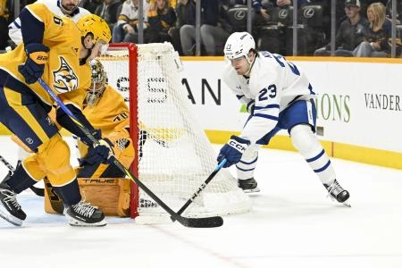 Dec 20, 2025; Nashville, Tennessee, USA; Nashville Predators left wing Erik Haula (56) blocks the shot of Toronto Maple Leafs left wing Matthew Knies (23) during the second period at Bridgestone Arena.