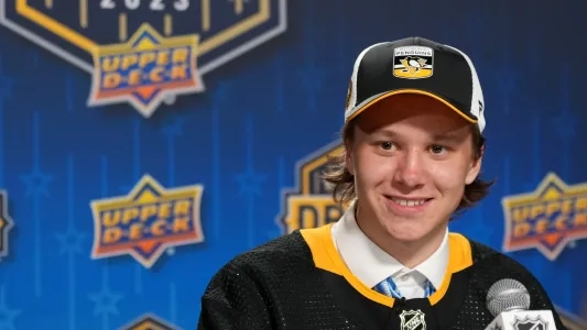 Pittsburgh Penguins' Emil Pieniniemi sits at the draft to talk