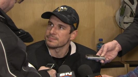 Pittsburgh Penguins' Sidney Crosby answers questions in the locker room