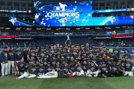 Oct 20, 2025; Toronto, Ontario, CAN; The Toronto Blue Jays celebrate on the field after defeating the Seattle Mariners in game seven of the ALCS round for the 2025 MLB playoffs at Rogers Centre. Mandatory Credit: Nick Turchiaro-Imagn Images