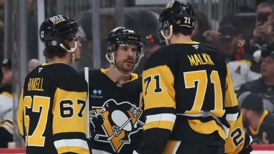 Pittsburgh Penguins players have a discussion during a stoppage in play