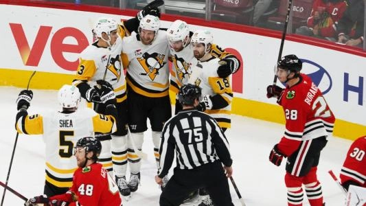 Pittsburgh Penguins players celebrate a goal vs. the Chicago Blackhawks