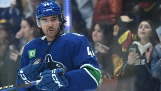 Vancouver Canucks' Kiefer Sherwood looks on during a game