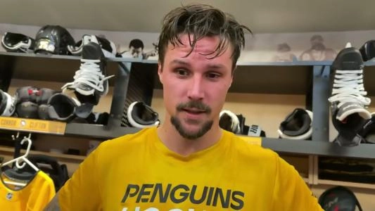 Pittsburgh Penguins' Erik Karlsson speaks to reporters in the dressing room